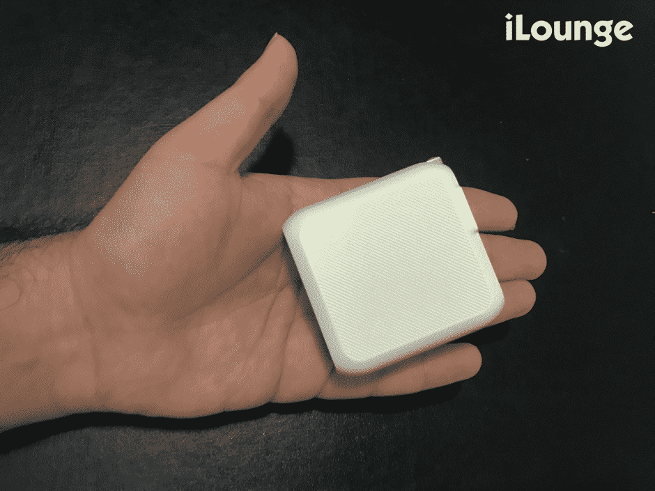 A hand holding the Xcentz 45W USB-C Power Adapter