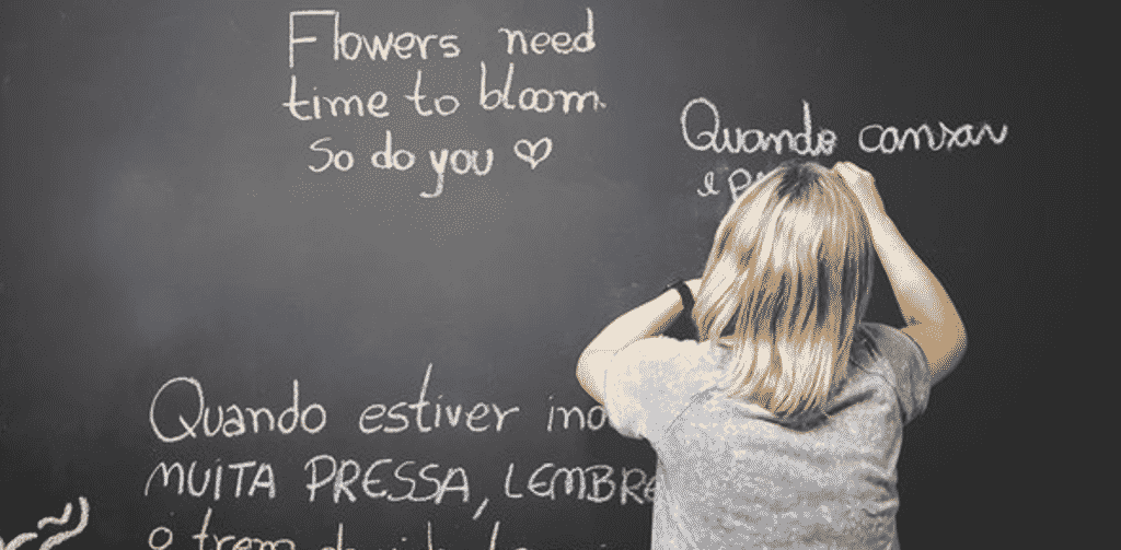 A kid writing on a black board after reading the Mastering Thinking Skills Bundle Ft. Timothy Kenny