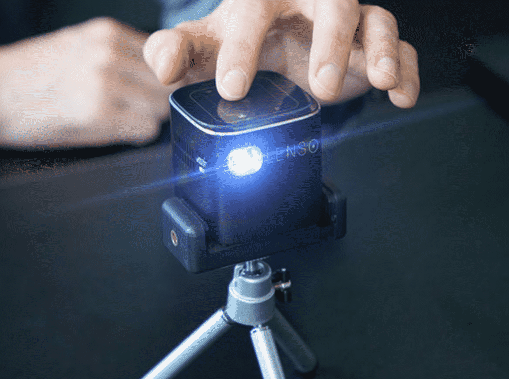Lenso Cube 1080P Pocket Projector with a human hand.