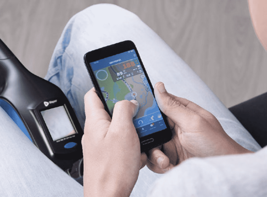 LifePro FlexCycle Under Desk Exercise Bike with a man holding his phone