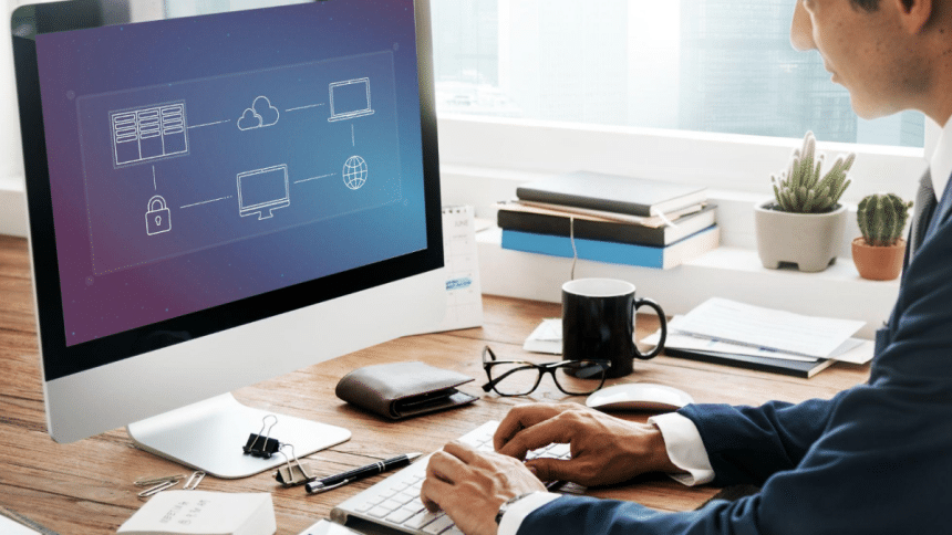 A suited man using a PDF page splitter on his computer.